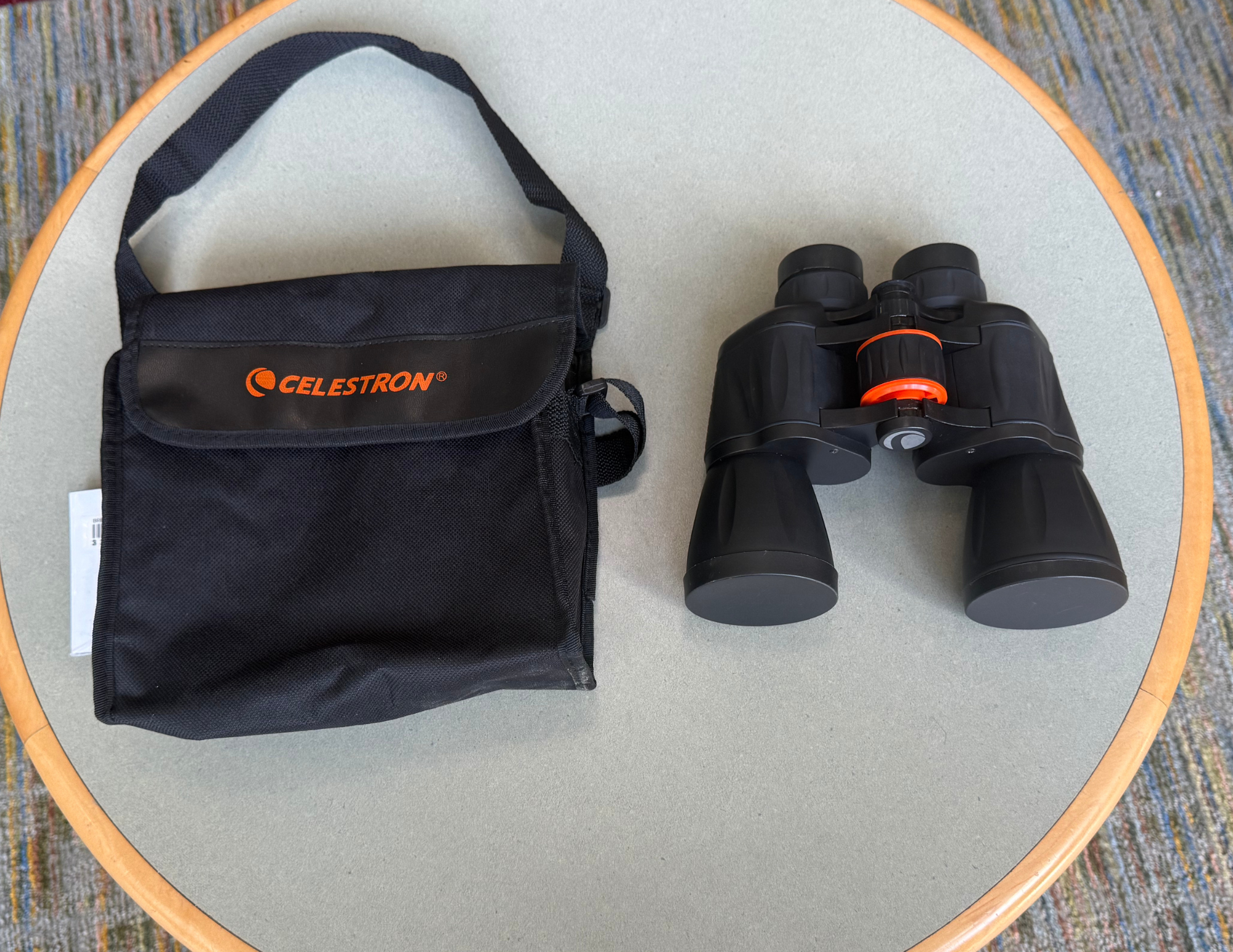 photo of a pair of binoculars and their case