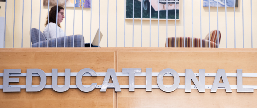 Girl studying above ERC sign